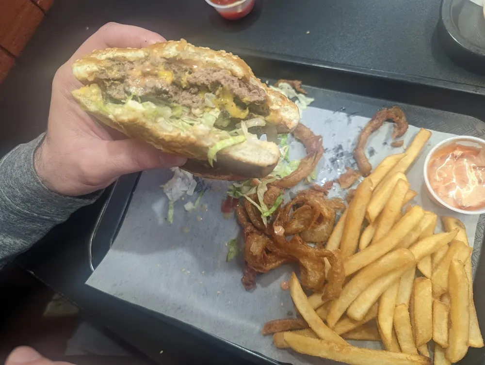 Double Cheeseburger with Onion Rings and Fries